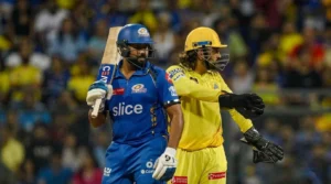 MI vs CSK players in action on the field, featuring a Mumbai Indians batsman and Chennai Super Kings wicketkeeper during an IPL match.